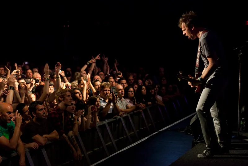 Tommy performing for a packed crowd